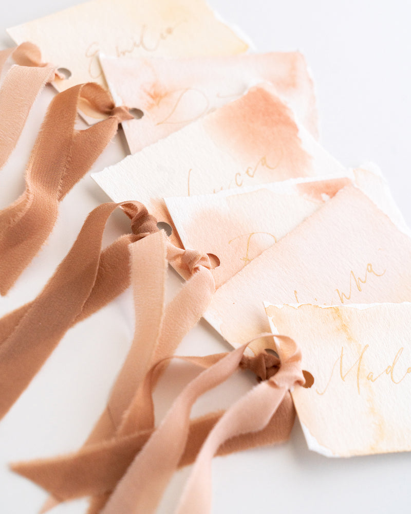 Tono + co Silk Ribbon Trim in Peach and Rose Gold. Perfect for stationary styling, boutonnieres, and detail work. Find your inspiration through color and silk. Lovingly hand-dyed in Santa Ana, California and available in 24 signature colors. Check out our website for more styling, flat-lay, and color tips.