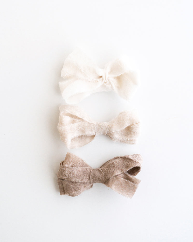Tono + co Silk Ribbon Trim in Cotton. Perfect for stationary styling, boutonnieres, and detail work. Find your inspiration through color and silk. Lovingly hand-dyed in Santa Ana, California and available in 24 signature colors. Check out our website for more styling, flat-lay, and color tips.